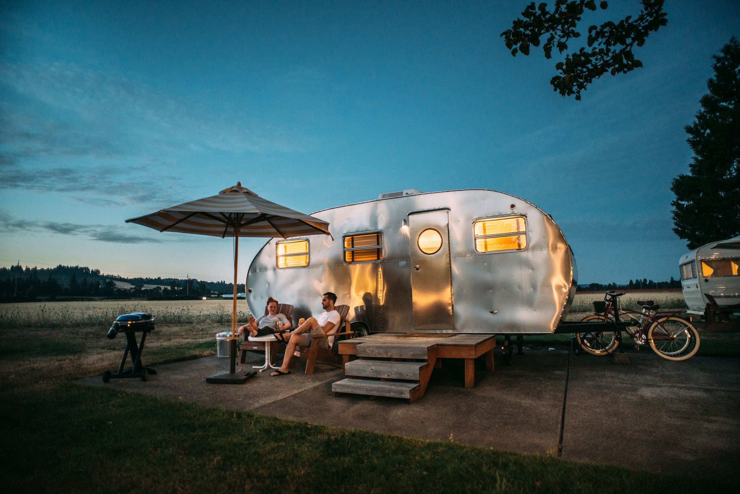 RV parked under open sky on a scenic route
